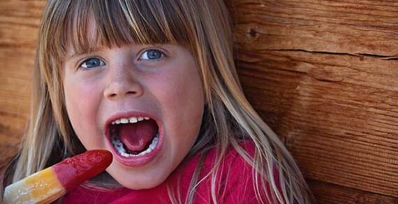 Girl eating popsicle COVID-19 underscores ‘invisible pandemic’ of diet-related diseases