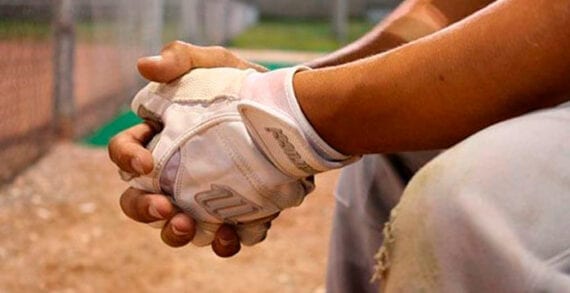 Baseball player sittnig on the bench Baseball all-star shift puts spotlight on Colorado’s exceptional voting laws