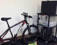 MedBIKE system stationary bike linked with tablet and video game Fitness program encourages kids with heart disease to train safely at home